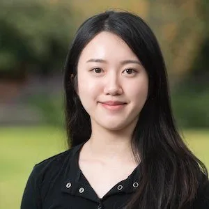 dietitian with white top with plant on background