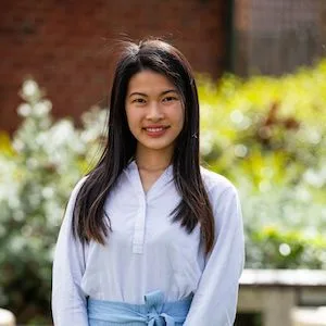 dietitian with white top with plant on background