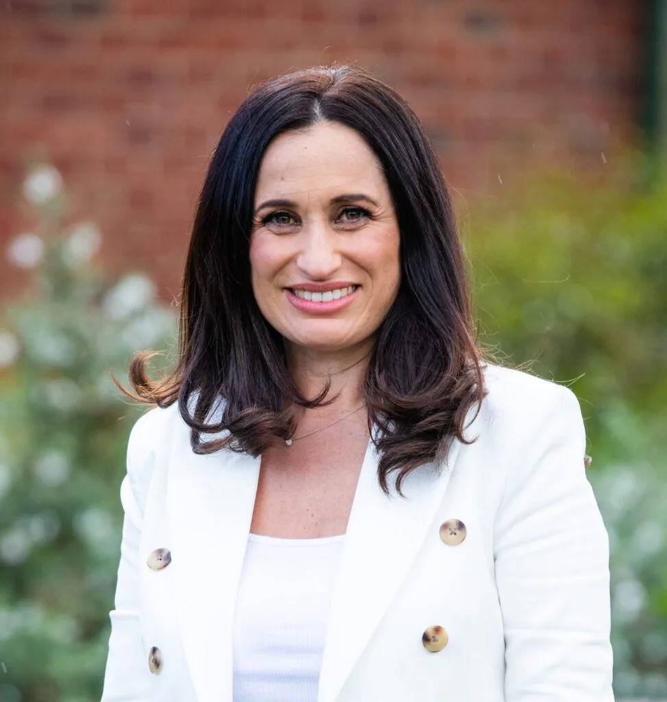 Dietitian at Nutrition Health & Wellbeing, in a white blazer smiling