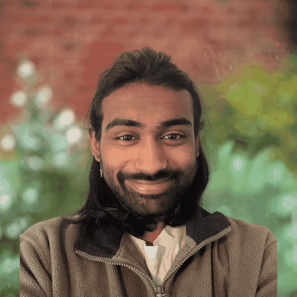 Accredited Practising Dietitian smiling in front of a garden backdrop